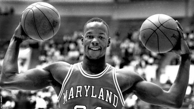 Len Bias poses holding two basketballs during his time with University of Maryland