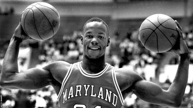 Len Bias poses holding 2  basketballs during his clip  with University of Maryland