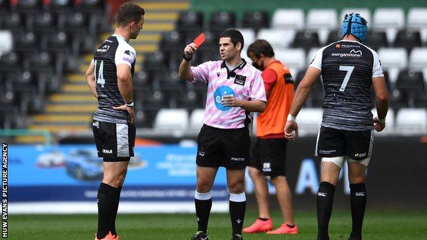 Referee Adam Jones sent off George North in his first league game in charge