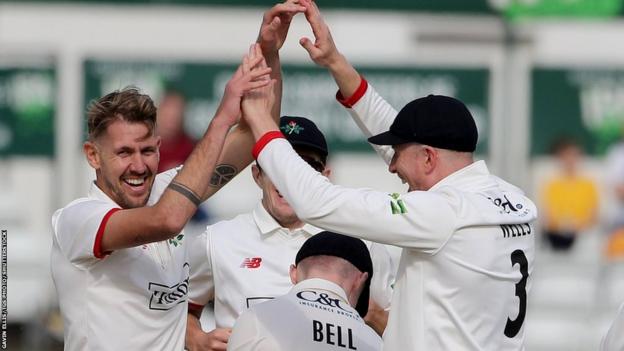 Lancashire paceman Tom Bailey celebrates a wicket