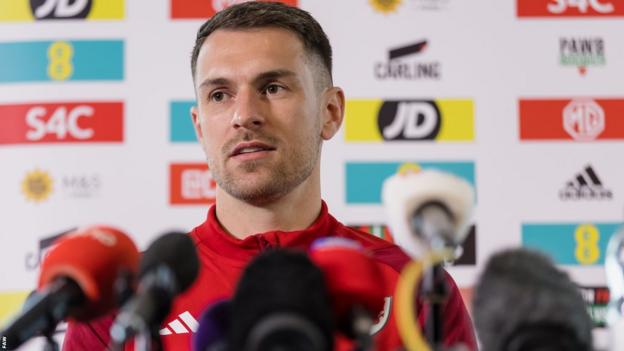 Aaron Ramsey speaks to the media