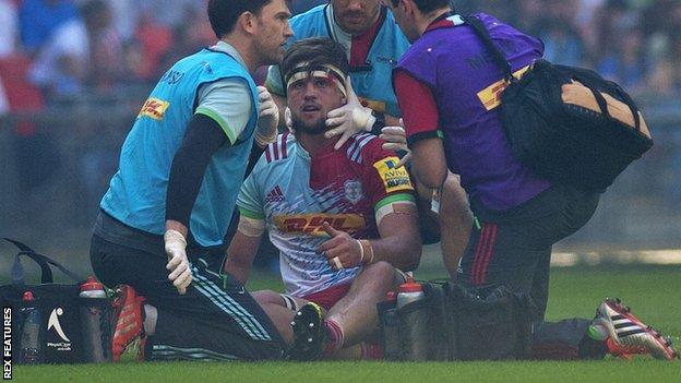 Jack Clifford picks up a head injury during Saracens v Harlequins