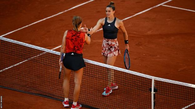 Karolina Muchova and Maria Sakkari shake hands at the net