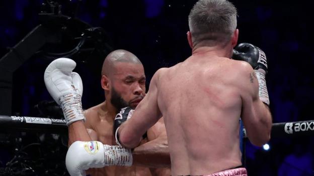 Chris Eubank Jr is punched connected  the chin by Liam Smith