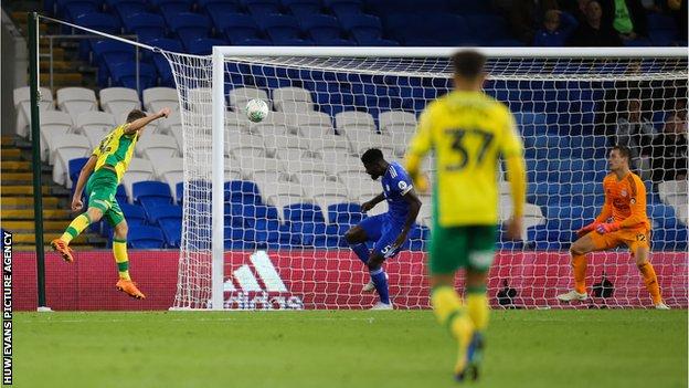 Norwich's Dennis Srbeny heads home his second goal against Cardiff