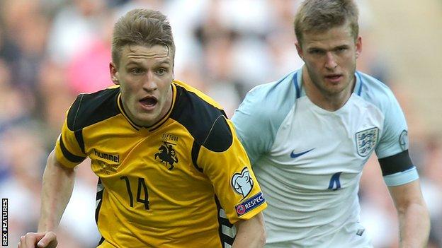 Lithuania's Vykintas Slivka with England's Eric Dier