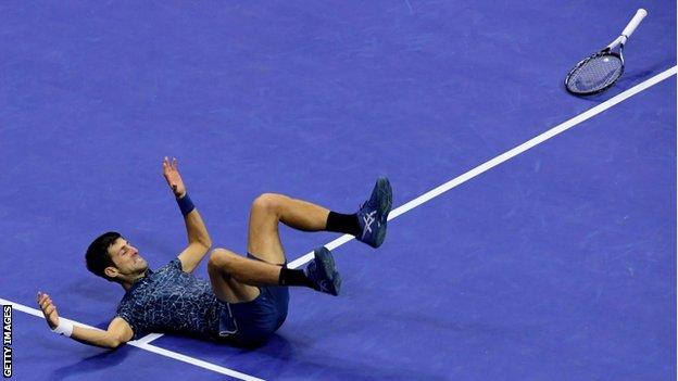 Novak Djokovic collapses to the court after winning the Us Open final against Juan Martin del Potro