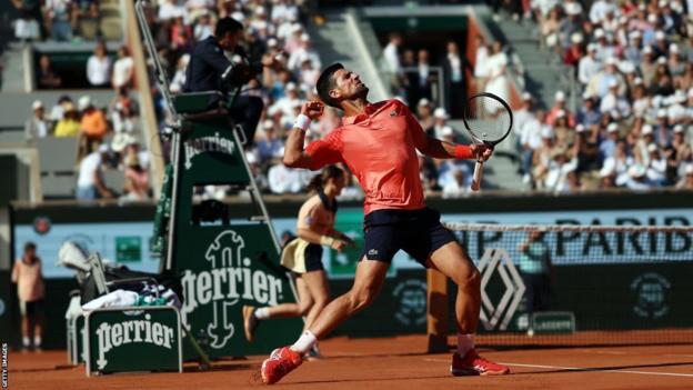 Novak Djokovic punches the air