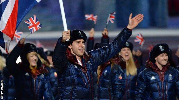 Jon Eley carries the British flag during the 2014 Winter Olympics opening ceremony