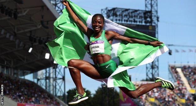 Nigeria's Tobi Amusan celebrates winning gold at the Commonwealth Games in Birmingham