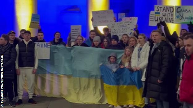 Oleksandr Zinchenko among the crowd protesting against Russia's invasion of Ukraine