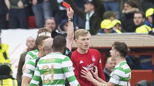Aberdeen substitute Sam Cosgrove is shown the red card for a challenge on Scott Brown