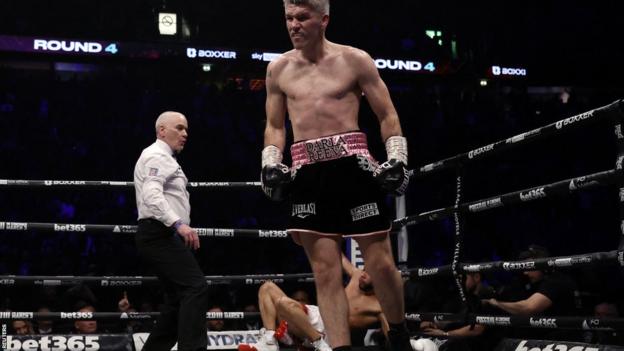 Liam Smith walks away from Chris Eubank on the canvas