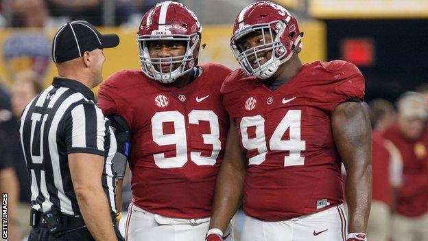 Jonathan Allen and Daron Payne talk to the referee