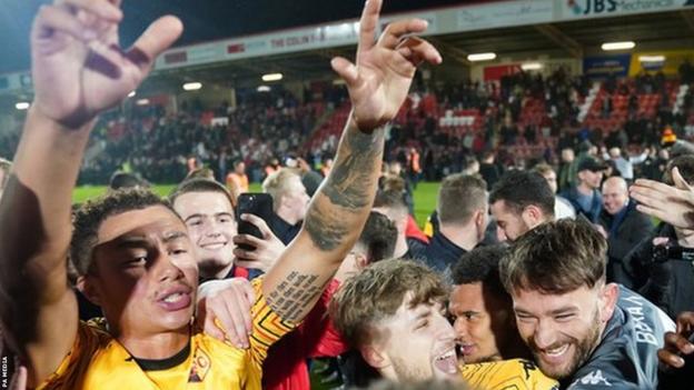 Alvechurch players celebrate defeating Cheltenham Town in the FA Cup first round