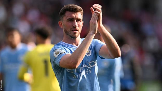 Aymeric Laporte applauds fans following Manchester City's 2-1 defeat by Brentford in May
