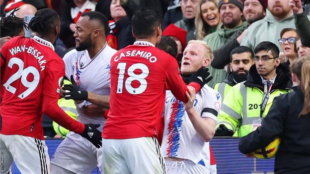 Casemiro of Manchester United clashes with Will Hughes of Crystal Palace