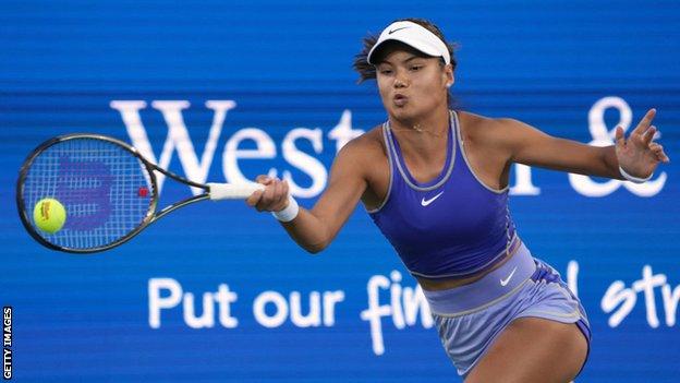 Emma Raducanu stretches for a ball during her Western and Southern Open defeat by Jessica Pegula