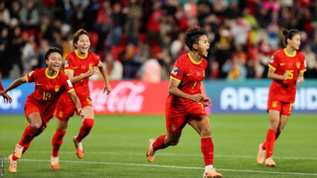China players celebrate their victory over Haiti