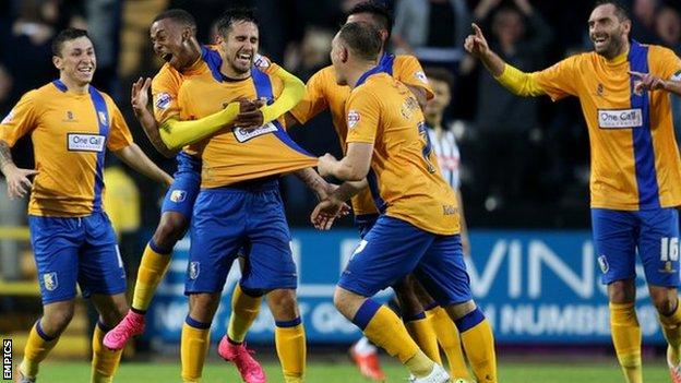 Mansfield Town players celebrate Chris Clements's first-half goal
