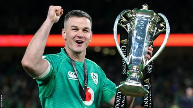 Ireland fly-half Johnny Sexton holds up the Six Nations trophy after his side completed the Grand Slam