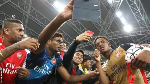 Chuba Akpom with the match ball after scoring a hat-trick for Arsenal in a pre-season friendly against a Singapore Select XI