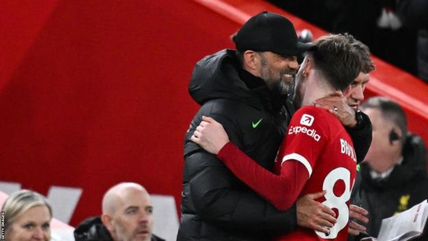 Liverpool boss Jurgen Klopp hugs Conor Bradley