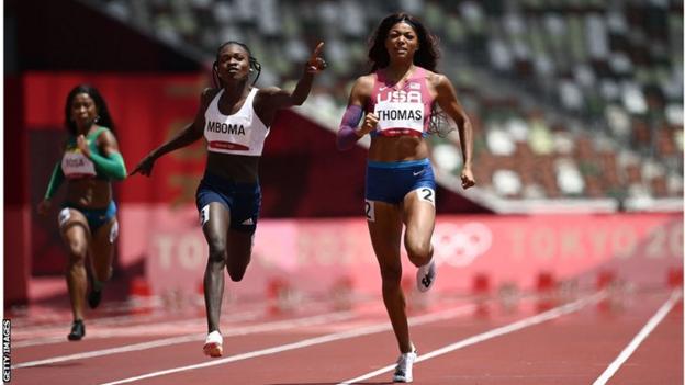 Namibia's Christine Mboma (right) celebrates winning her 200m heat at the Tokyo Olympics ahead of USA's Gabrielle Thomas
