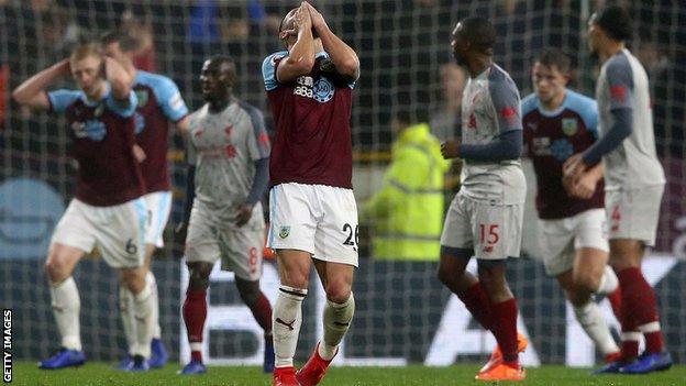 Philip Bardsley of Burnley (centre) reacts after a chance is missed