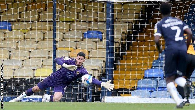 Tom King made a fine save from Matt Rush's penalty