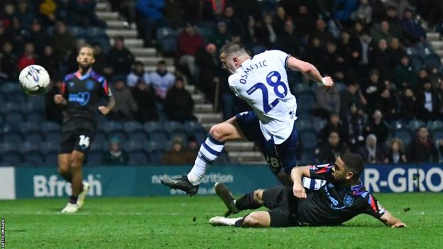 Preston North End's Milutin Osmajic scores his team's fourth goal during the Sky Bet Championship match between Preston North End and Huddersfield Town at Deepdale on April 9, 2024 in Preston, England