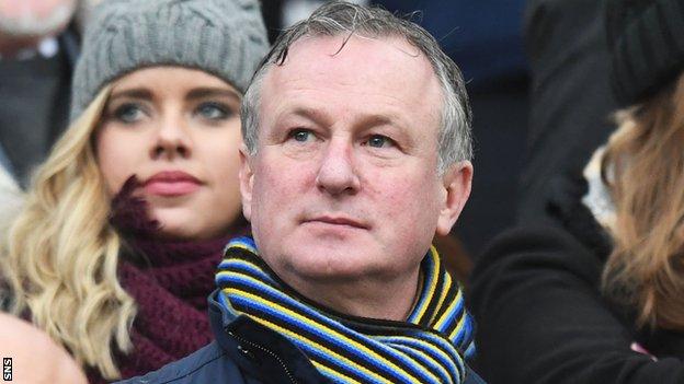 Michael O'Neill watches Hearts v Hibs in the Scottish Cup