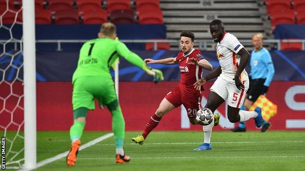 Diogo Jota (centre) tries to find a way past Dayot Upamecano
