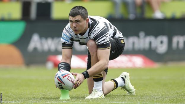 Jake Clifford lines up a kick at goal for Hull FC