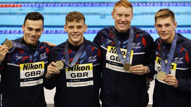 Gold medallists James Guy, Matthew Richards, Tom Dean and Duncan Scott show off their medals