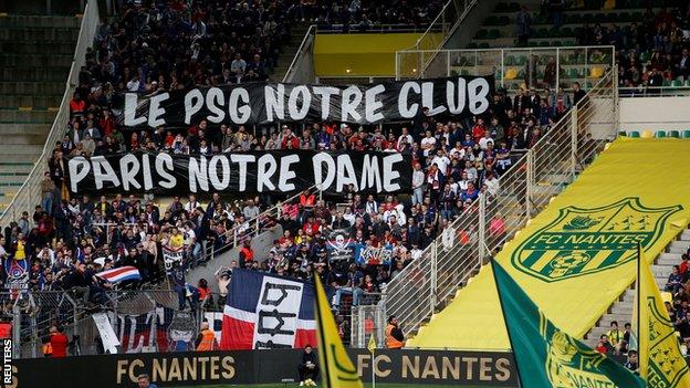 PSG fans held up a banner in honour of the Notre-Dame cathedral in Paris, which was severely damaged in a fire on Monday