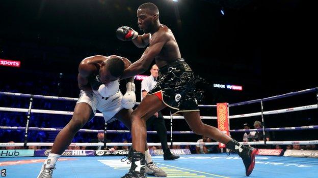 Lawrence Okolie (right) punches Isaac Chamberlain