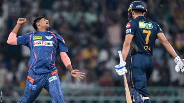 Lucknow Super Giants bowler Yash Thakur celebrates taking the wicket of Gujarat Titans captain Shubman Gill