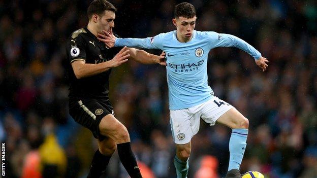 Phil Foden (right) in Premier League action for Man City against Leicester City