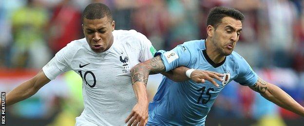 Kylian Mbappe of France and Giorgian De Arrascaeta of Uruguay