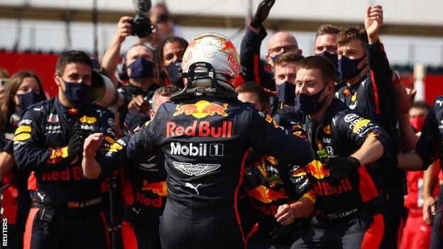 Verstappen celebrates with the Red Bull team