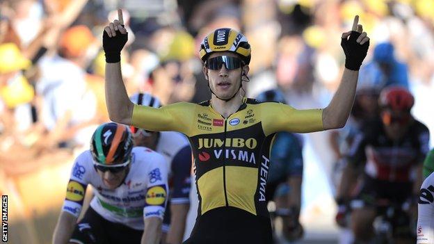 Wout van Aert puts his arms up in celebration after winning stage five of the 2020 Tour de France