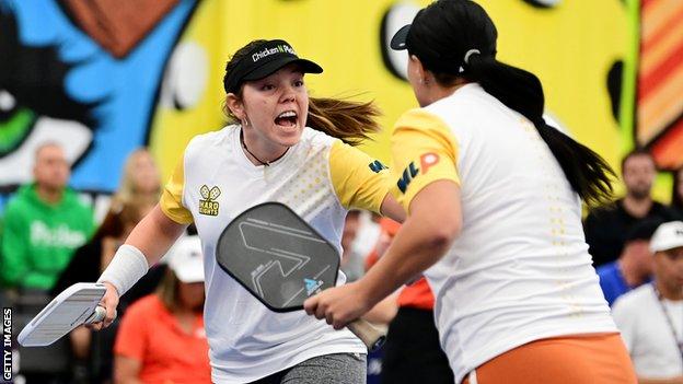 Hard Eights players Jorja Johnson and Cierra Gaytan-Leach celebrate during a Major League Pickleball match against BLQK in October 2022