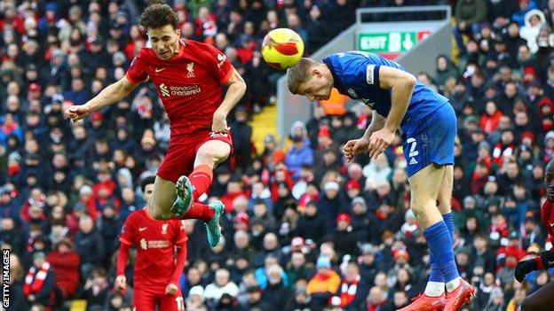 Diogo Jota rises to head home Liverpool's opening goal