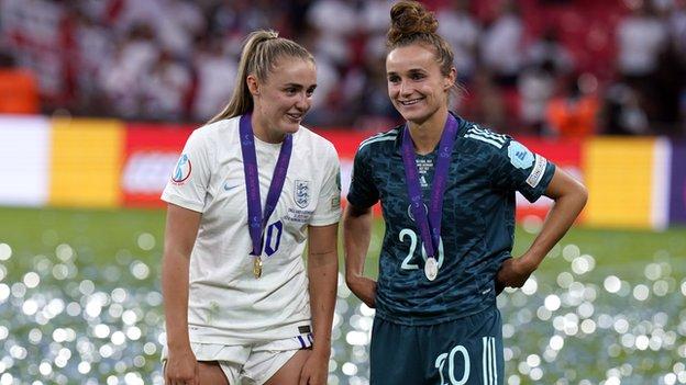 Georgia Stanway chats to Lina Magull after the Euro 2022 final