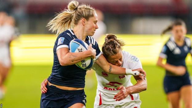 Great Britain's Emma Uren fends off Poland's Malgorzata Koldej