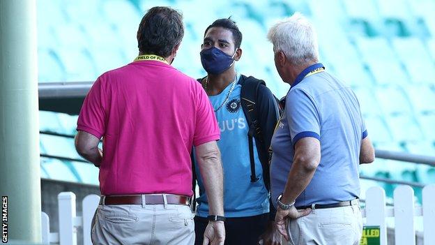 India fast bowler Mohammed Siraj speaks to Cricket Australia staff after day three of the third Test