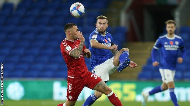 Joe Ralls and Jack Hunt challenge for the ball