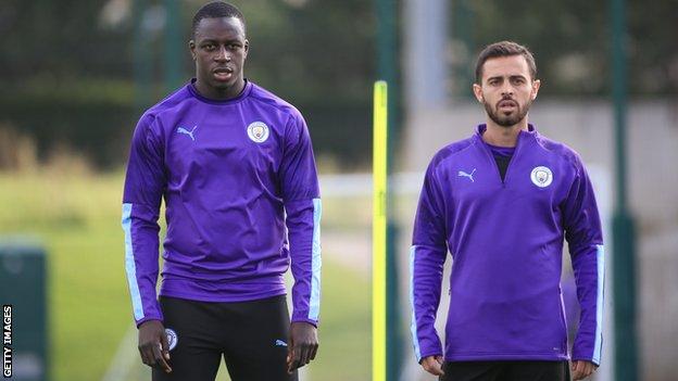 Manchester City players Benjamin Mendy (left) and Bernardo Silva (right)