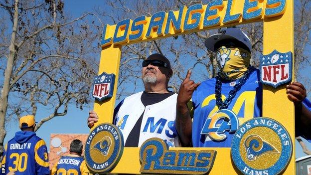 Fans posing for a picture during the Los Angeles Rams' trophy parade
